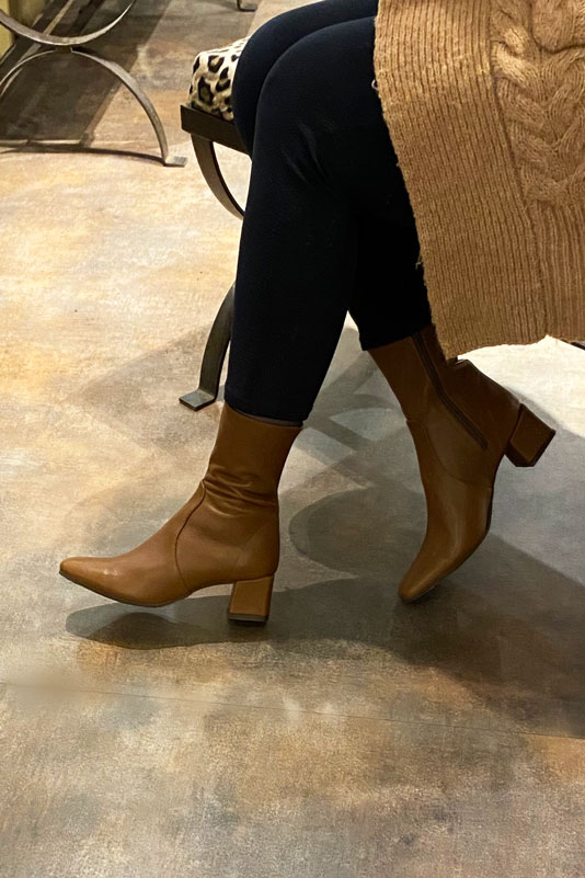 Caramel brown women's ankle boots with a zip on the inside. Square toe. Medium block heels. Worn view - Florence KOOIJMAN